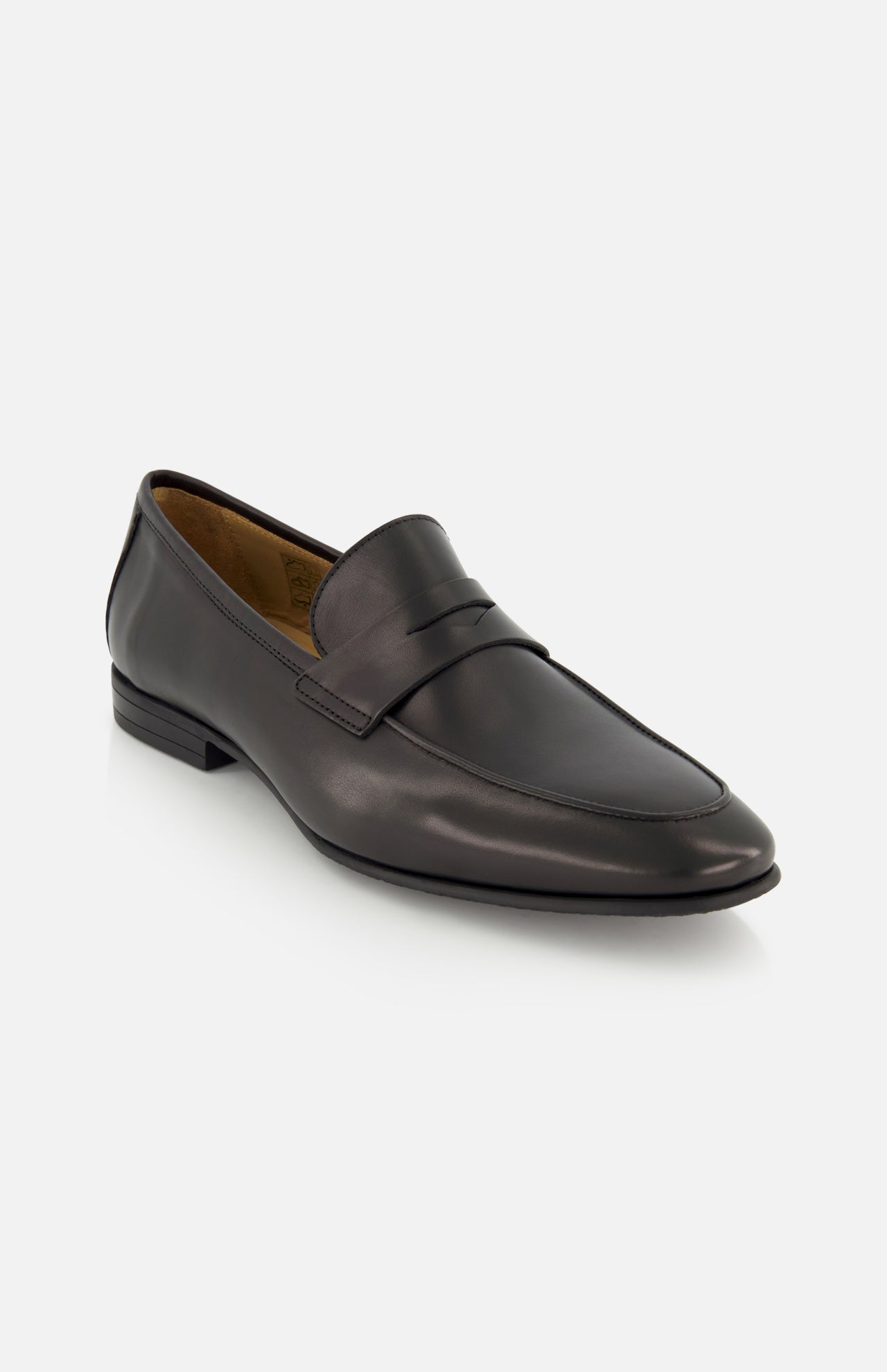 The Keats Leather Penny Loafer by TO BOOT is a sleek, minimalist black Italian leather slip-on with a low heel, showcased on a white background—combining timeless style and modern sophistication for the perfect dress shoe.