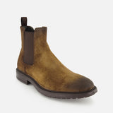 Introducing the Largo Suede Chelsea Boot by TO BOOT—a brown suede men’s boot featuring a subtle worn effect, dark elastic side panels, a pull tab at the back, rounded toe, and low heel. Displayed against a white background, this essential footwear piece combines classic style with everyday versatility.