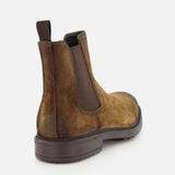 The Largo Suede Chelsea Boot by TO BOOT, a classic men’s footwear staple, is crafted in brown suede with a dark elastic side panel and pull tab, shown from the back against a white background.