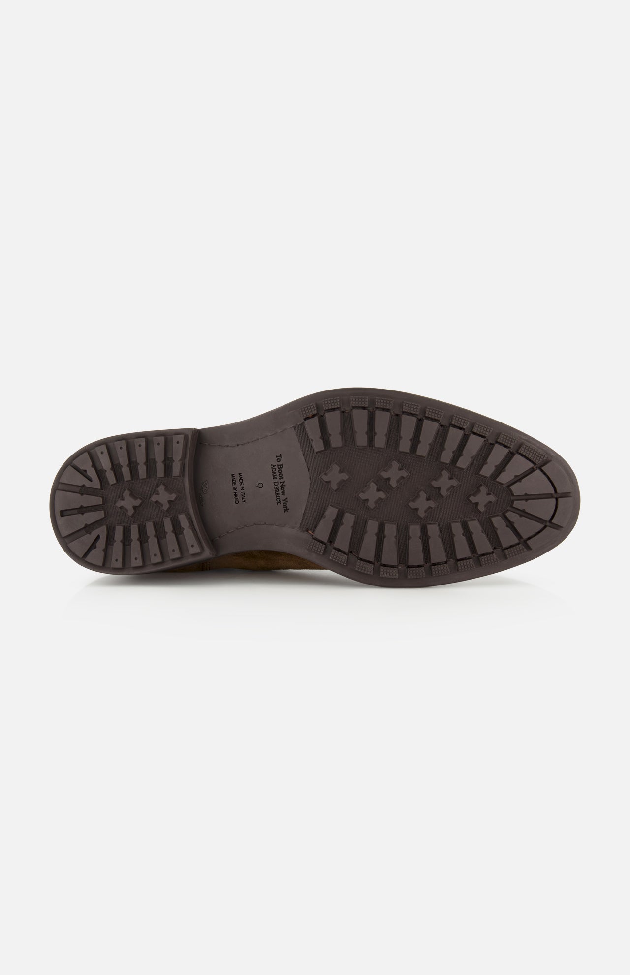 The image displays the sole of the TO BOOT Largo Suede Chelsea Boot for men—a dark brown suede Chelsea boot—featuring a patterned tread for grip, shown from the bottom against a plain white background.