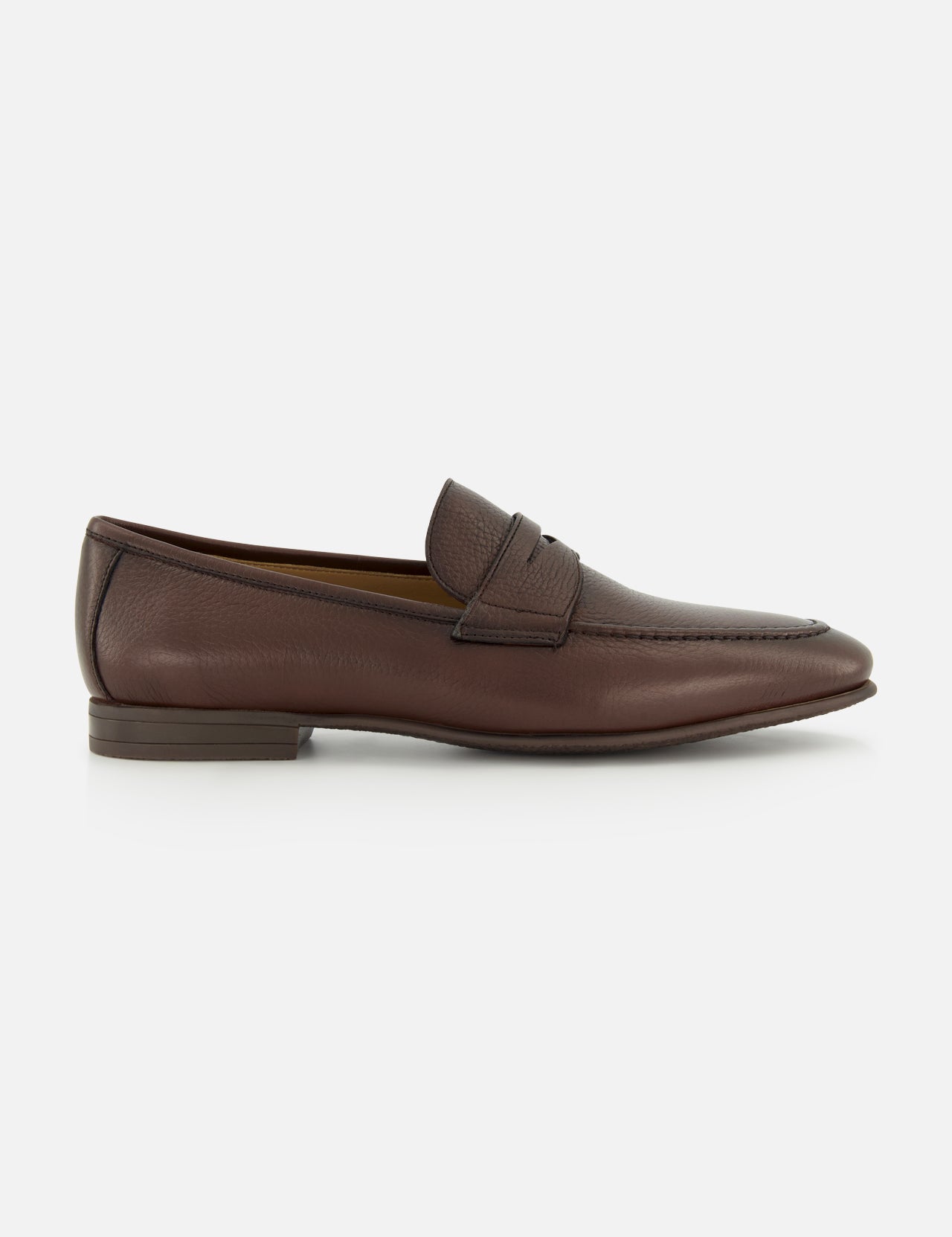 The TO BOOT Merritt Deer Leather Penny Loafer is a classic brown penny loafer crafted from luxurious Italian deer leather, featuring a low heel, visible stitching, and a signature penny strap detail. It is displayed on a plain white background.