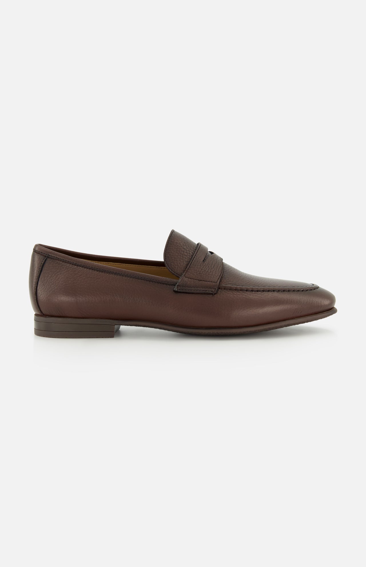The TO BOOT Merritt Deer Leather Penny Loafer is a classic brown penny loafer crafted from luxurious Italian deer leather, featuring a low heel, visible stitching, and a signature penny strap detail. It is displayed on a plain white background.