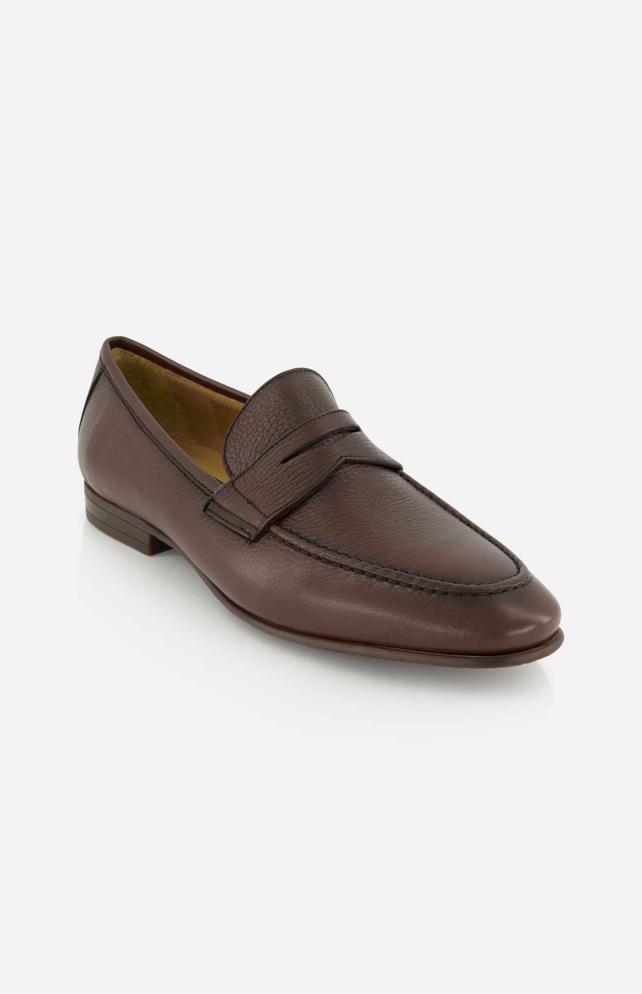 The Merritt Deer Leather Penny Loafer by TO BOOT, crafted from supple Italian deer leather with a low heel and moccasin-style toe, is displayed on a white background.