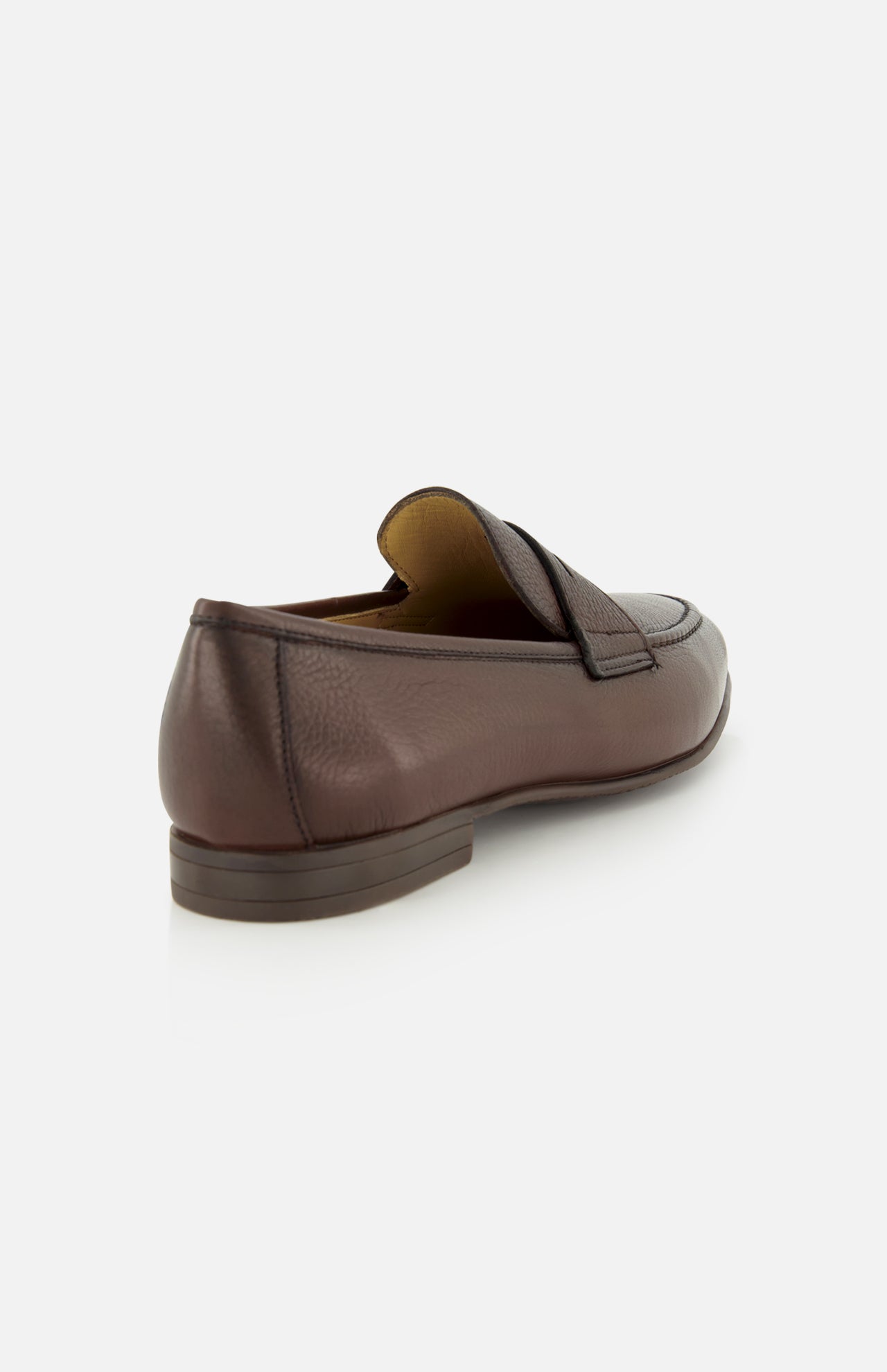 A single Merritt Deer Leather Penny Loafer by TO BOOT, expertly crafted from luxurious Italian deer leather in brown, is displayed from the back and slightly to the side against a plain white background.