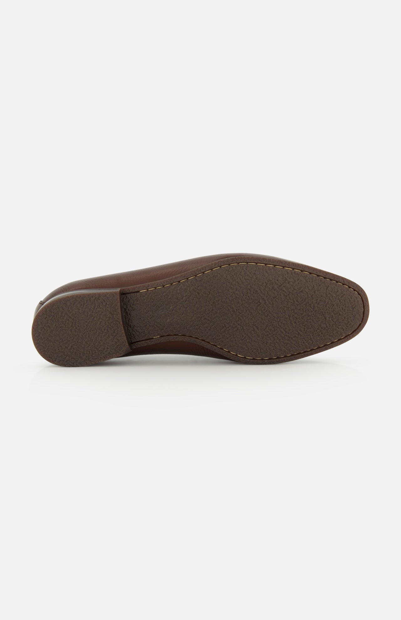 The image displays the bottom view of the TO BOOT Merritt Deer Leather Penny Loafer, featuring a textured rubber sole and prominent stitching around the edge that highlights the craftsmanship characteristic of classic loafers.