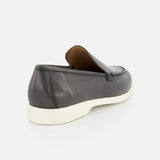 The TO BOOT Pacific Leather Hybrid Loafer, in dark grey leather with a white sole, is displayed from the rear on a plain white background.