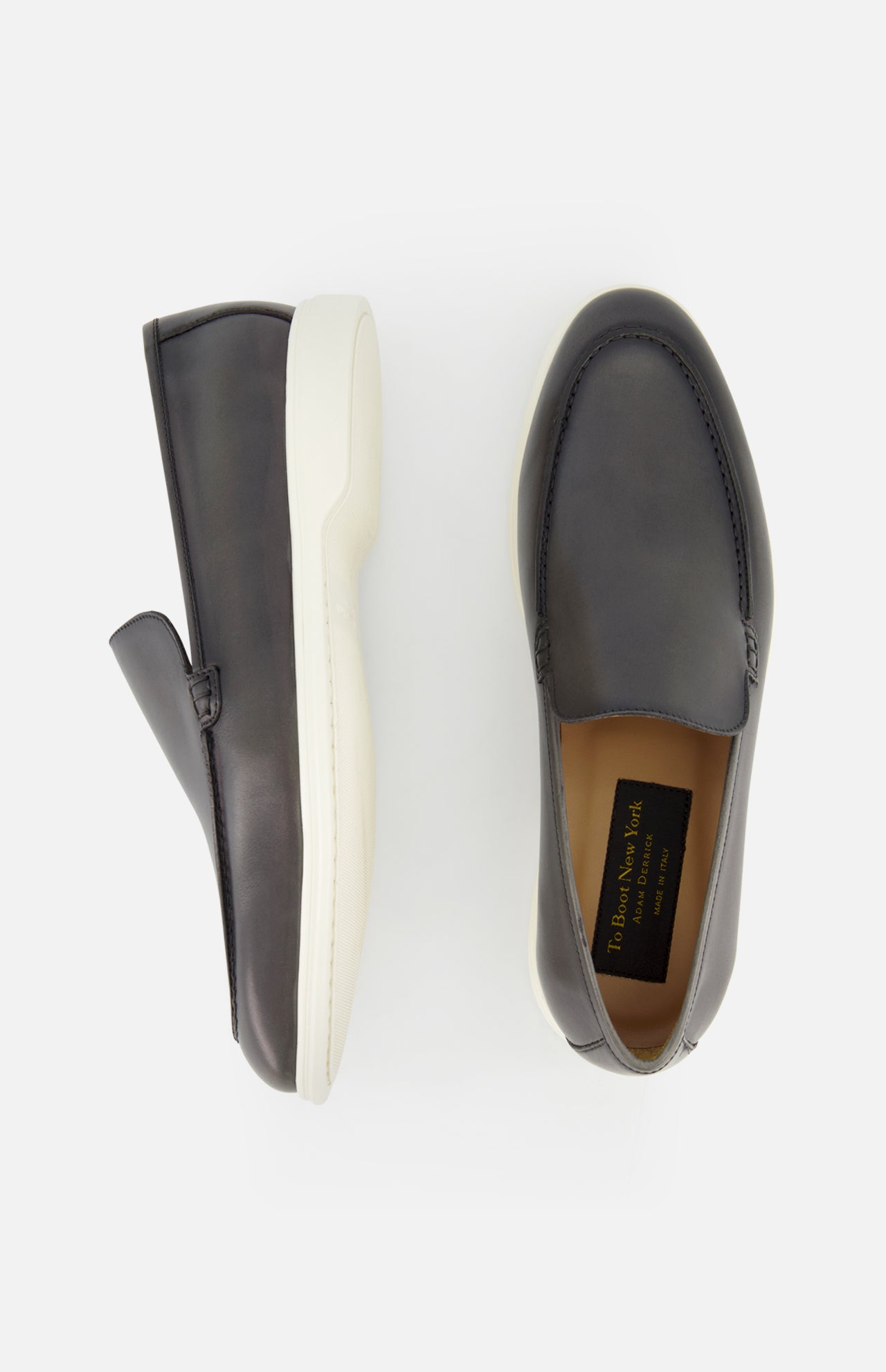 Top and side view of the TO BOOT Pacific Leather Hybrid Loafer in black leather with white rubber soles, displayed on a plain white background.