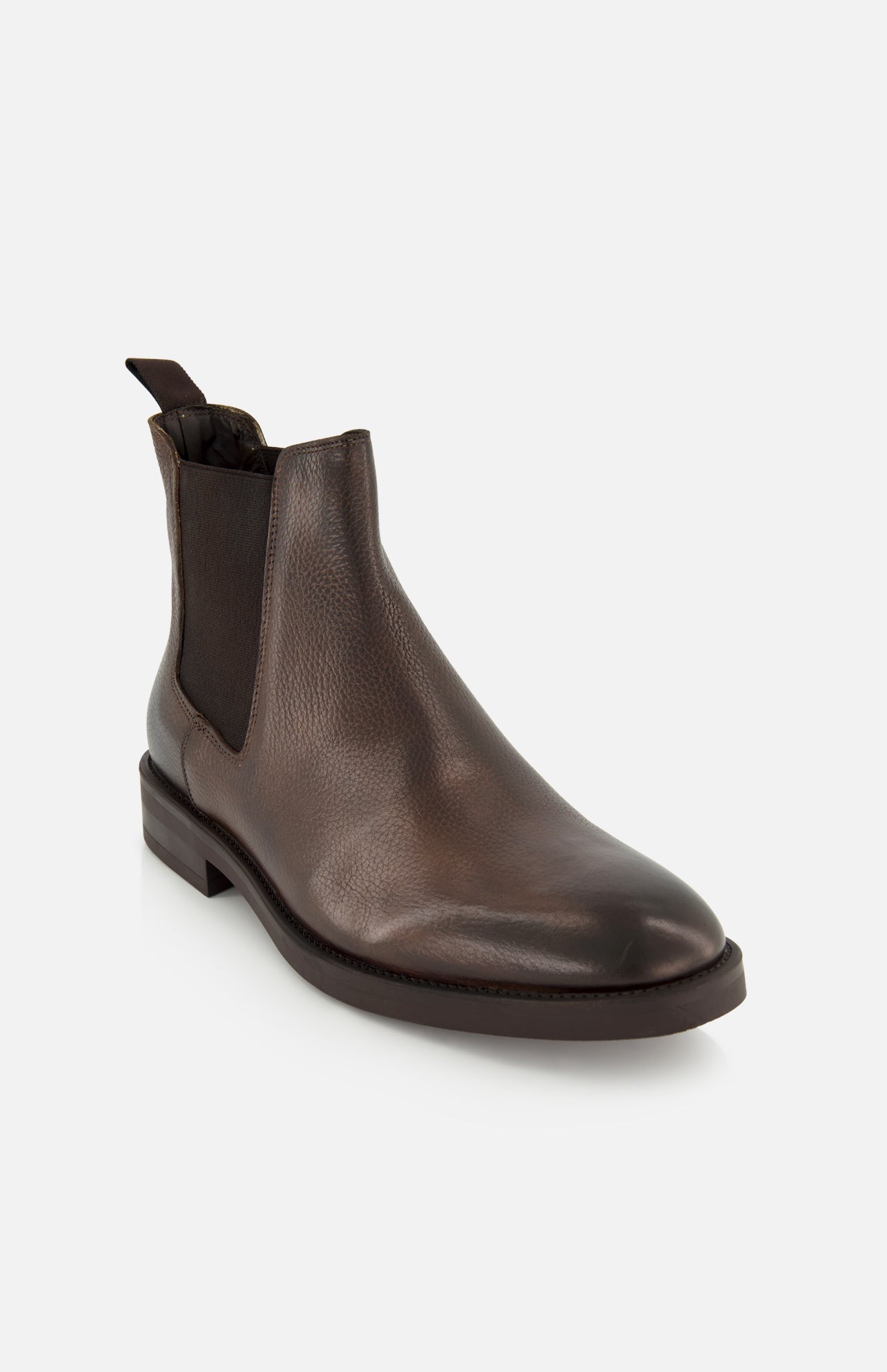 The Peabody Chelsea Boot by TO BOOT is a men’s fall boot in grained leather with elastic side panels and a pull tab at the back, shown on a white background.