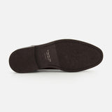 The image displays the bottom view of a Peabody Chelsea Boot by TO BOOT in dark brown, featuring a textured sole and visible writing near the heel against a white background.