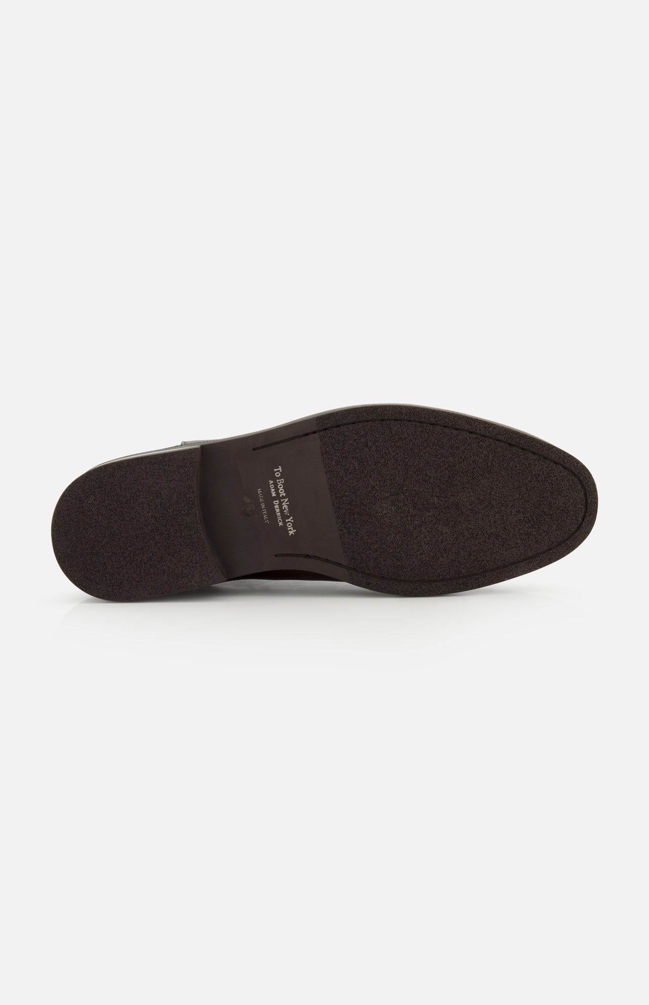 The image displays the bottom view of a Peabody Chelsea Boot by TO BOOT in dark brown, featuring a textured sole and visible writing near the heel against a white background.