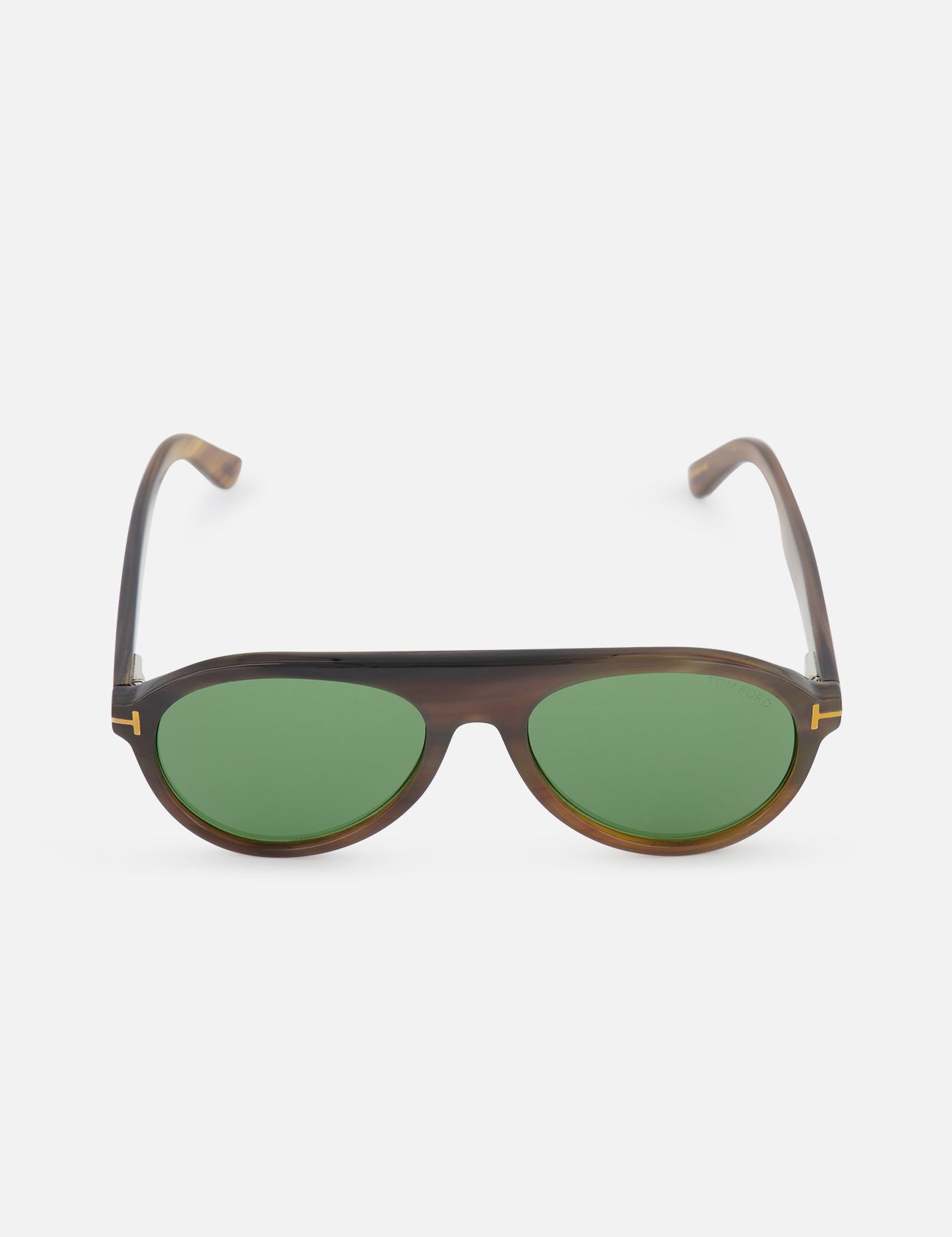 A pair of TOM FORD Pilot Horn Sunglasses with brown round frames, green lenses, and subtle gold accents at the corners displays a hint of horn design on a white background.