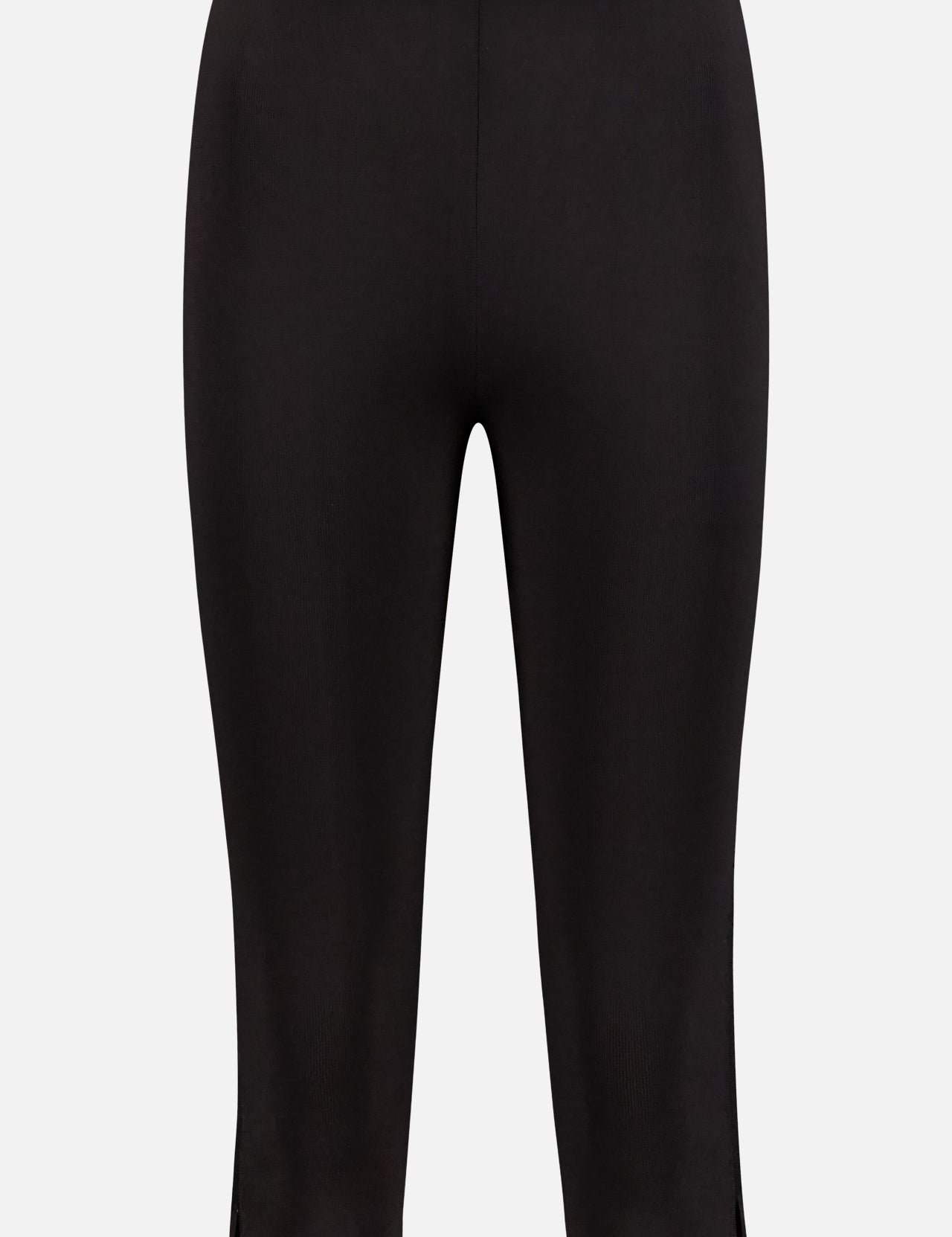 TOTEME’s Compact Knit Capri Trouser Pants in black feature a mid-rise slim fit, small hem slits, and a fitted silhouette—versatile capri trousers stylishly displayed against a plain white background.