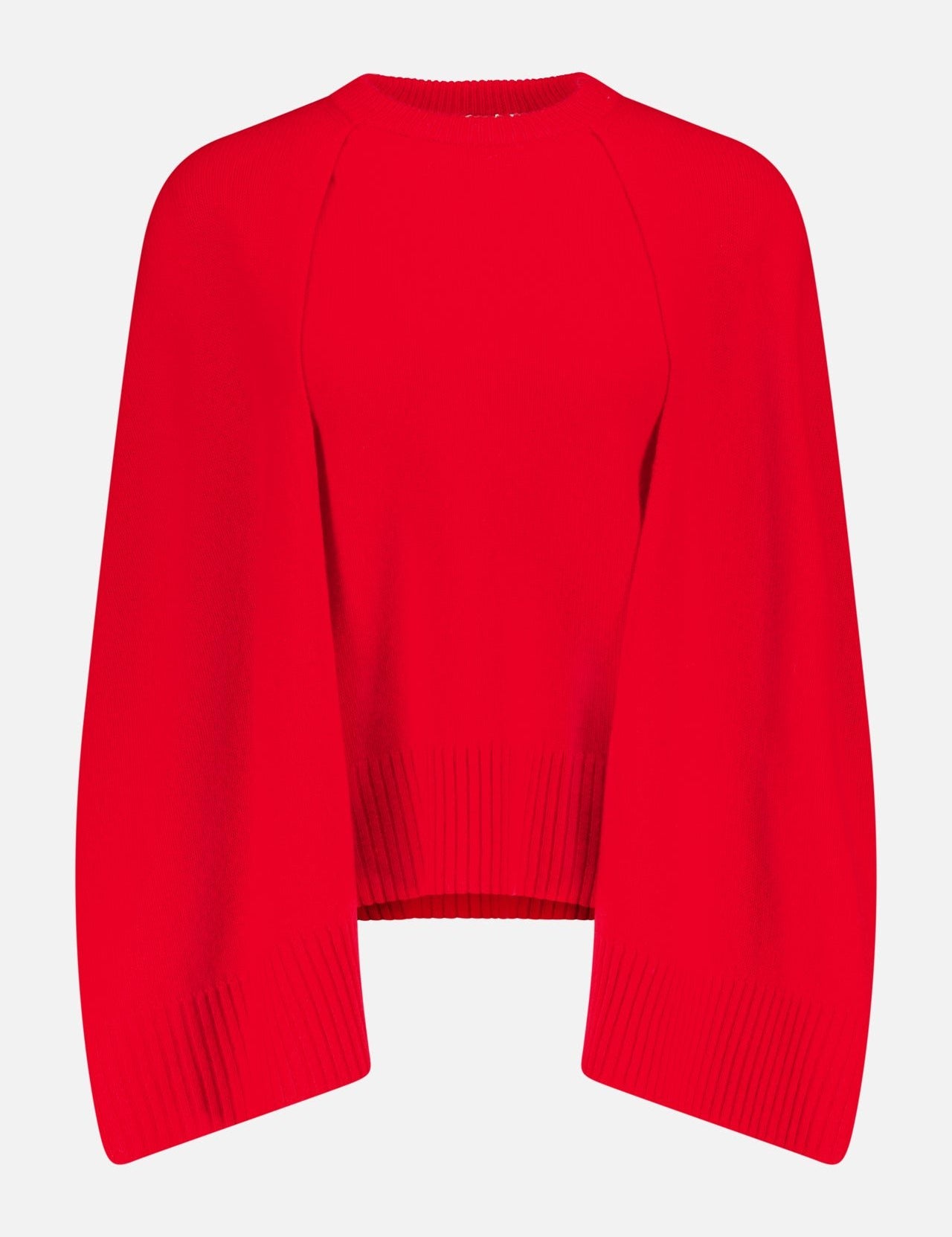 The TOTEME Crew Knit Cape Sweater is a bright red cashmere top with long, wide sleeves and ribbed hem and cuffs, shown on a plain white background.