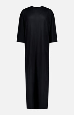 The TOTEME Merino Knit T-shirt Dress is an oversized, loose-fitting, short-sleeve black midi dress with a crew neckline, shown on a white background.