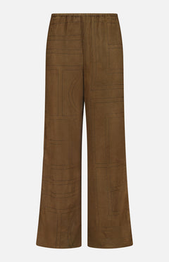 TOTEME Monogram Flannel PJ Bottoms in dark brown feature a subtle geometric pattern, an elasticated waistband, and a straight-leg silhouette, shown against a white background.