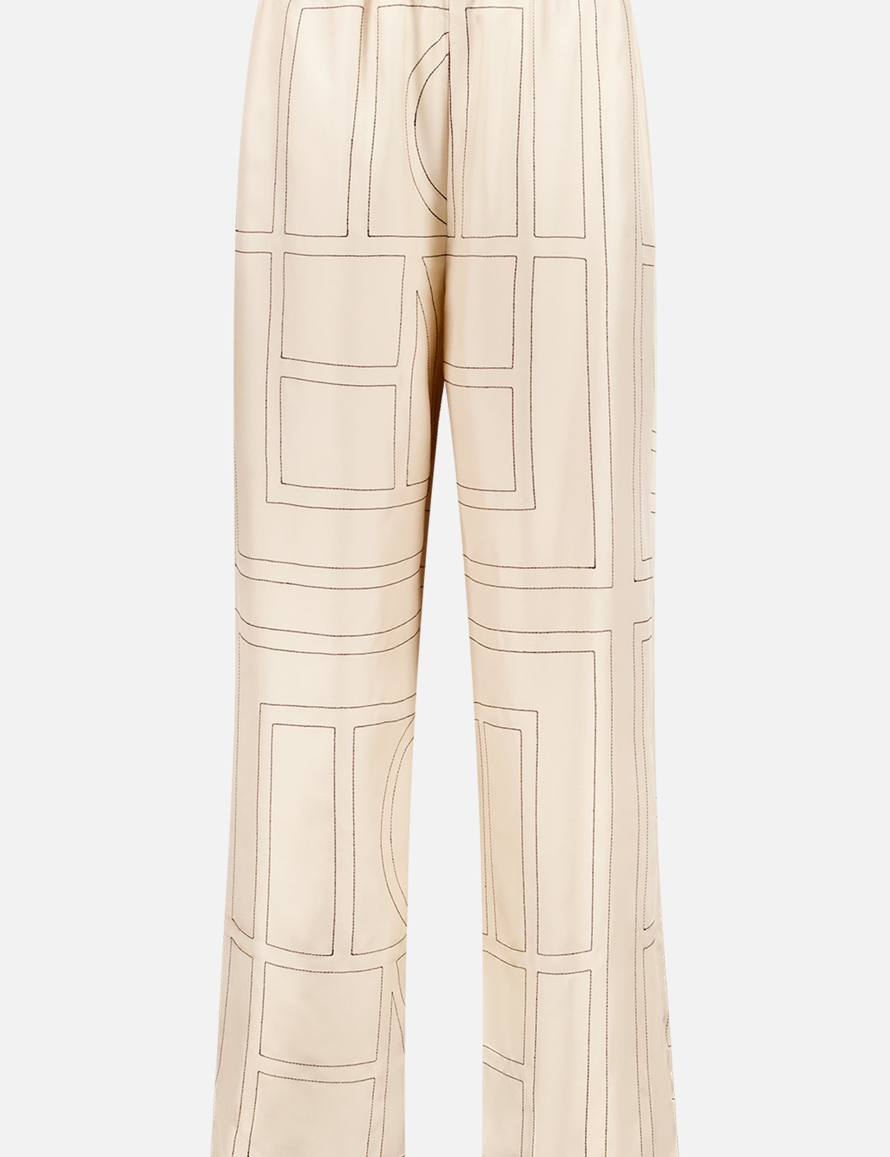 TOTEME’s Monogram Silk PJ Bottoms are ivory, straight-leg silk twill pants with a loose fit and elastic waistband, featuring a geometric monogram pattern in brown.