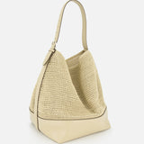 The TOTEME Belted Woven Leather Tote Bag, featuring beige woven leather, an adjustable strap, and leather trim at the base, is showcased against a white background.