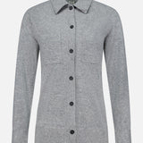 The TOTEME Cashmere Long Sleeve Cardigan is a light gray, featherlight cashmere button-up with long sleeves, a collar, and two chest pockets. Featuring a classic button-front closure, it is shown against a plain white background.