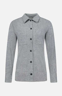 The TOTEME Cashmere Long Sleeve Cardigan is a light gray, featherlight cashmere button-up with long sleeves, a collar, and two chest pockets. Featuring a classic button-front closure, it is shown against a plain white background.