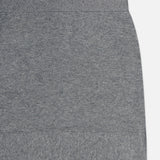 Close-up of the TOTEME Buttoned Cashmere Skirt in a slim fit grey design, featuring a ribbed waistband and hem, displayed against a white background. Only the upper right portion of the skirt is shown.