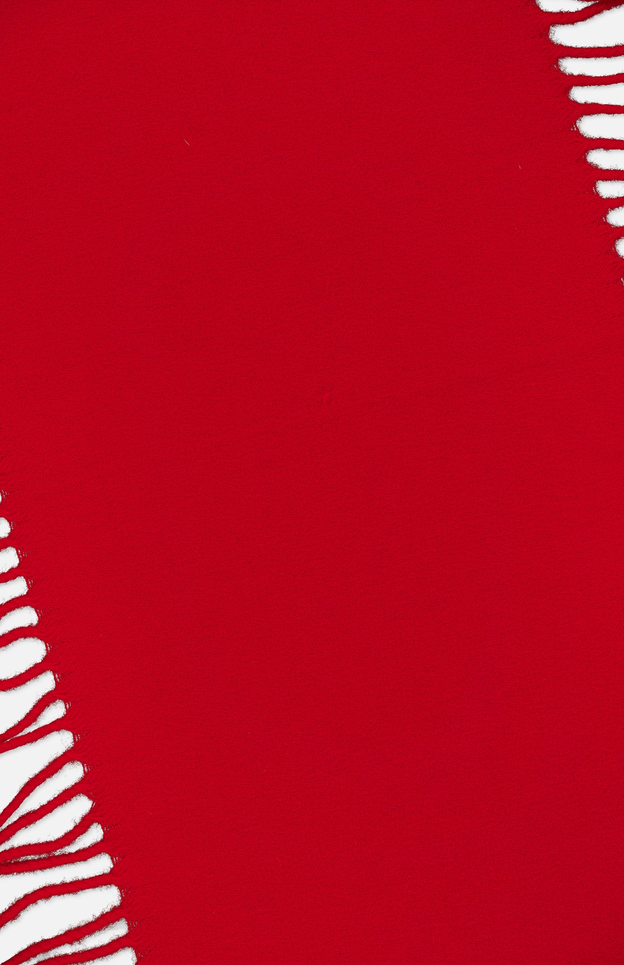 A vivid red TOTEME Wool and Cashmere Tassel Scarf is shown draped diagonally, with white fringed tassels visible along the left and top right edges. The arrangement leaves a bold expanse of red at the center, highlighting the luxurious Italian-made fabric.