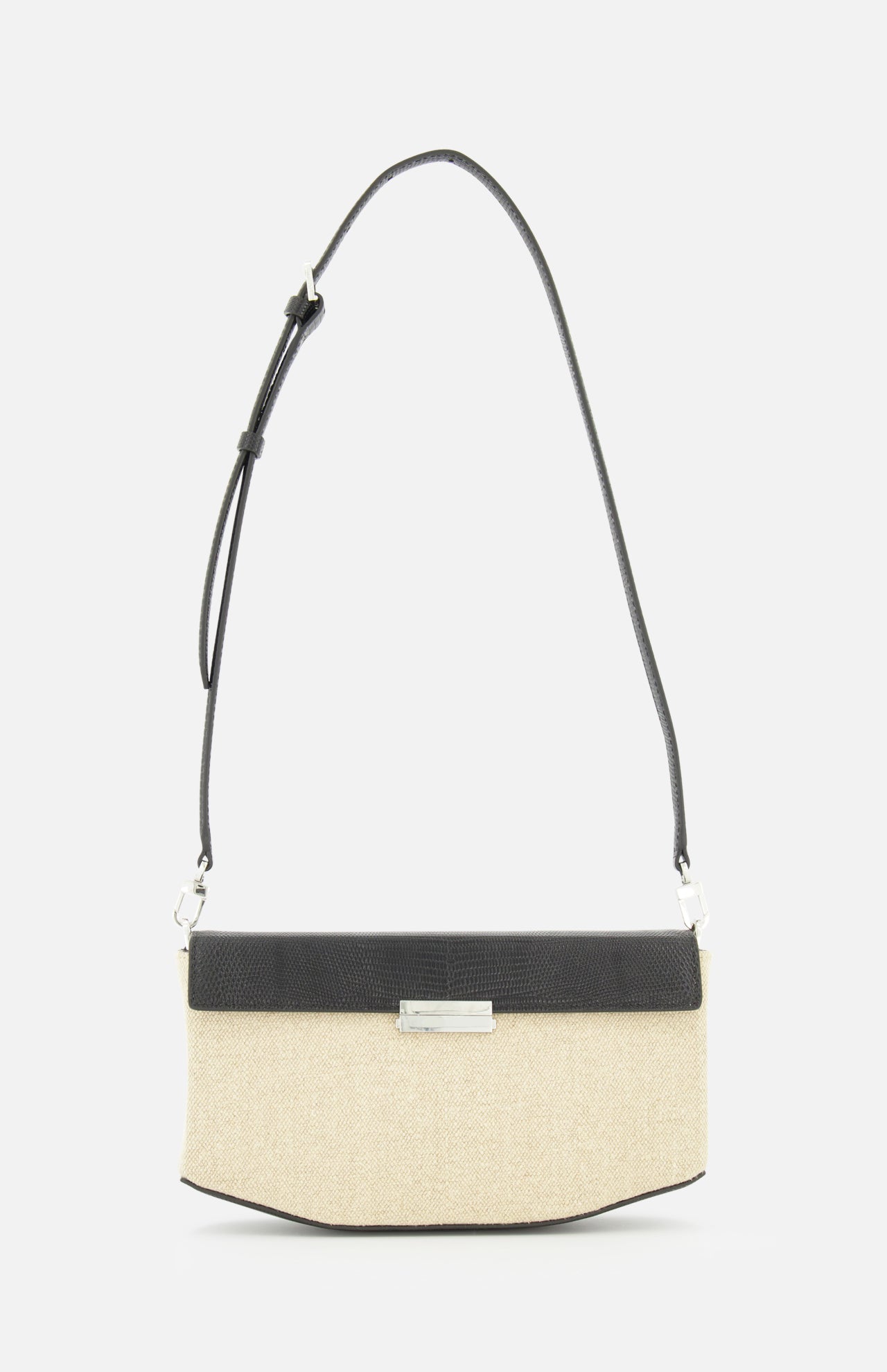 The TOTEME Clip Canvas Shoulder Bag is a rectangular beige and black accessory in canvas and leather, designed with a long adjustable strap, silver front clasp, and minimalist modern style, shown on a plain white background.