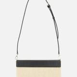 The TOTEME Clip Canvas Shoulder Bag is a beige rectangular design in canvas and leather with a black textured top panel and adjustable black strap, shown against a plain white background.