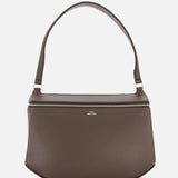 The TOTEME Clip Leather Shoulder Bag, crafted in Italy from dark brown leather, showcases a minimalist design with a wide strap and silver zipper, displayed against a plain white background.