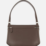 Introducing the Clip Leather Shoulder Bag by TOTEME—a dark brown leather handbag featuring a single handle, elegant silver zipper detailing, and a clean, minimalist design. The bag’s structured, boxy silhouette is showcased against a white background, emphasizing its timeless appeal and refined Italian craftsmanship.