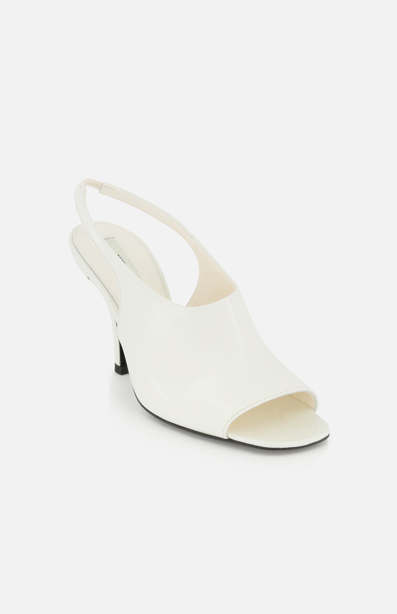 The Contour Naplack Slingback Heel by TOTEME is a white, premium leather peep-toe with a low black heel, shown on a plain white background.