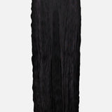 The TOTEME Crinkled Knit Pencil Skirt is a long black skirt with a semi-sheer, crinkled texture and straight silhouette, ideal for chic monochrome outfits. Shown against a plain white background.
