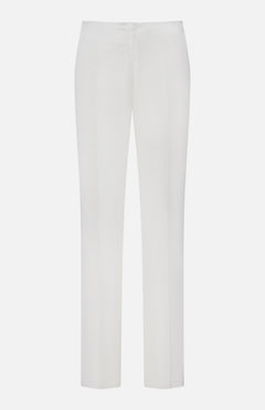 The TOTEME Easy Raw Edge Trouser Pants are tailored, office-ready white pants with a straight silhouette, flat front, and a minimalist design—no visible pockets or embellishments—shown against a plain white background.