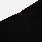 Close-up of TOTEME's Flared Jersey Skirt in black, highlighting its smooth, fabric texture and sleek finish against a plain white background.