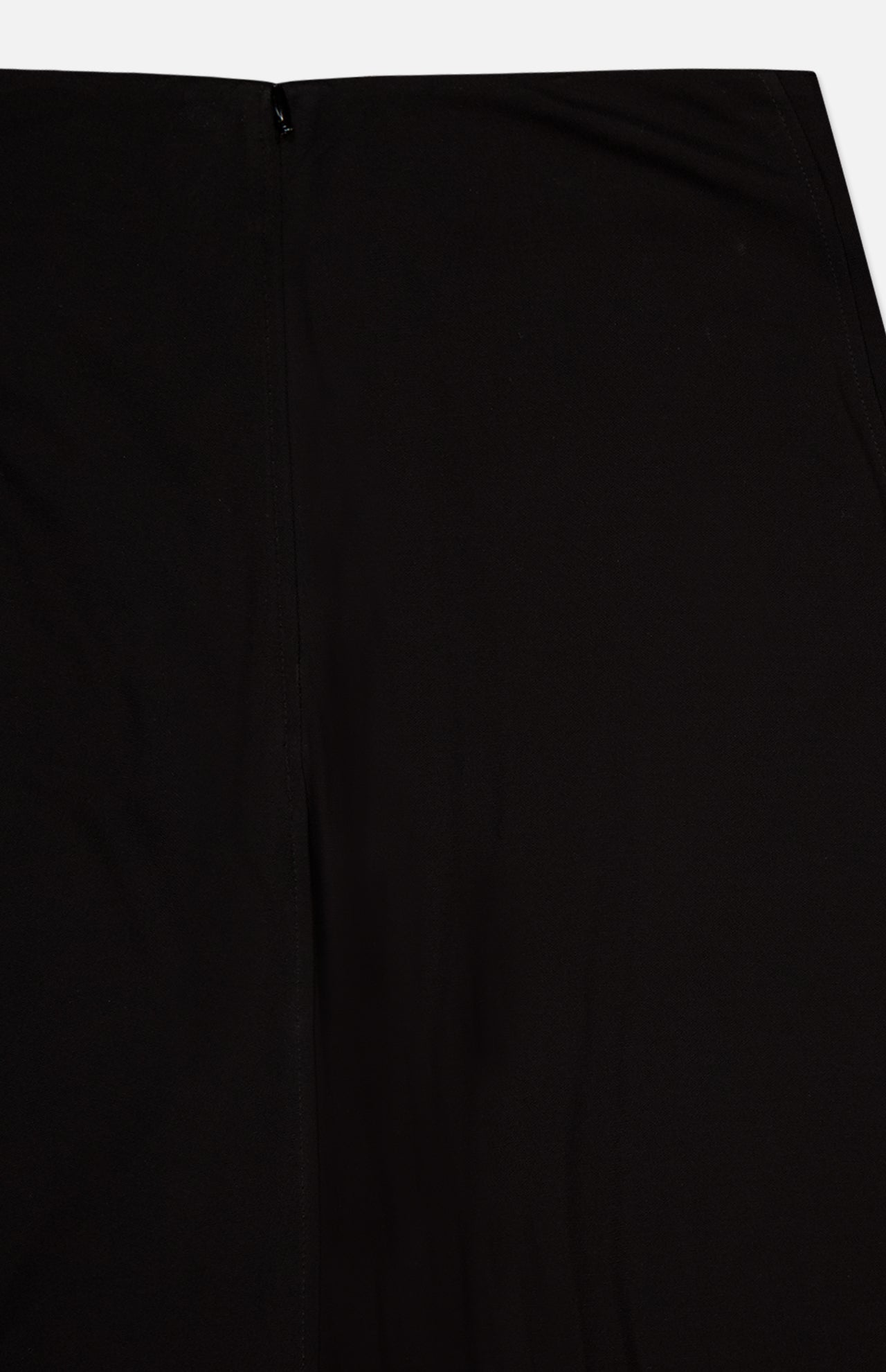 Close-up of the TOTEME Flared Jersey Skirt fabric in black, featuring a visible seam and black zipper at the top.