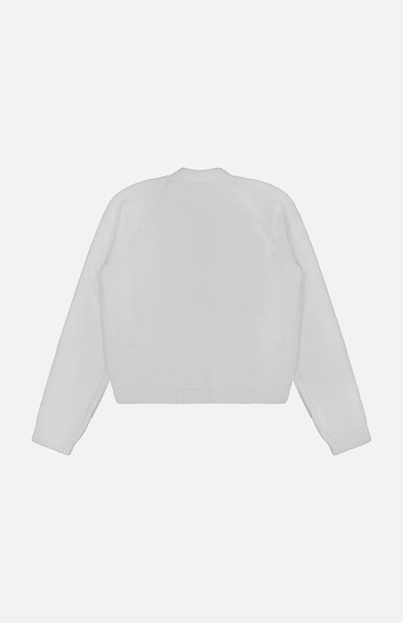 A plain white long-sleeve cardigan from TOTEME, the Hammered Button Cotton Cardigan, is laid flat with the back view visible against a light gray background. The cardigan features a crew neckline along with ribbed cuffs and hem, offering a classic cotton design.