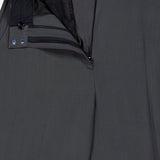 A pair of TOTEME High-Waisted Trouser Pants in dark grey, featuring a partially open waistband with zipper and button fly, showcasing the inner lining and belt loops at the top—ideal for those who appreciate classic office style.