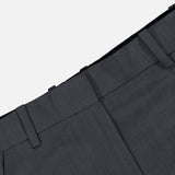 Close-up of the waistband and upper section of TOTEME’s High-Waisted Trouser Pants in dark grey, featuring belt loops and detailed stitching against a plain white background. These office pants offer a high-rise fit for a polished, professional appearance.