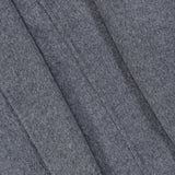 Close-up of the gray felt fabric from TOTEME’s Wool Hoodie Coat, featuring visible diagonal seams that highlight the texture and detailed stitching of the material.