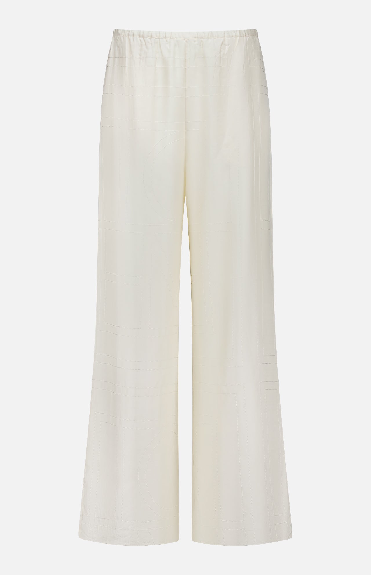 The TOTEME Monogram Silk PJ Bottoms are wide-leg, high-waisted ivory trousers with an elastic waistband, crafted from lightweight silk and detailed with a subtle embroidered monogram, shown against a plain white background.