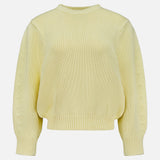 The TOTEME Oversized Crewneck Knit Sweater in butter yellow features long sleeves and a ribbed crew neckline, cuffs, and hem, shown against a plain white background.