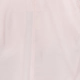 A close-up of TOTEME's Silk-blend Parachute Skirt in pale pink, featuring semi-sheer fabric, a central vertical seam, and a top zipper.