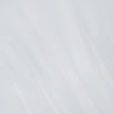 A close-up of the smooth, slightly wrinkled white cotton fabric from TOTEME’s Sculptural Cotton Top, with soft shadows highlighting the gentle folds and creases that lend this designer piece its refined, textured elegance.