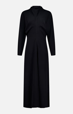 The TOTEME Slouch Waist Scarf Dress is a black, long-sleeved, knee-length dress featuring voluminous sleeves, a fitted waist, and a central seam detail, shown against a plain white background.
