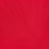 Close-up of vibrant red Slouch Waist Wool Dress by TOTEME, highlighting visible seams and stitching that form diagonal lines and a geometric pattern across the textured fabric.