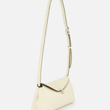 The TOTEME T-Lock Grained-Leather Clutch Bag is a minimalist cream accessory with a detachable strap, silver buckle, and structured rectangular shape, crafted from fine Italian leather and shown against a plain white background.