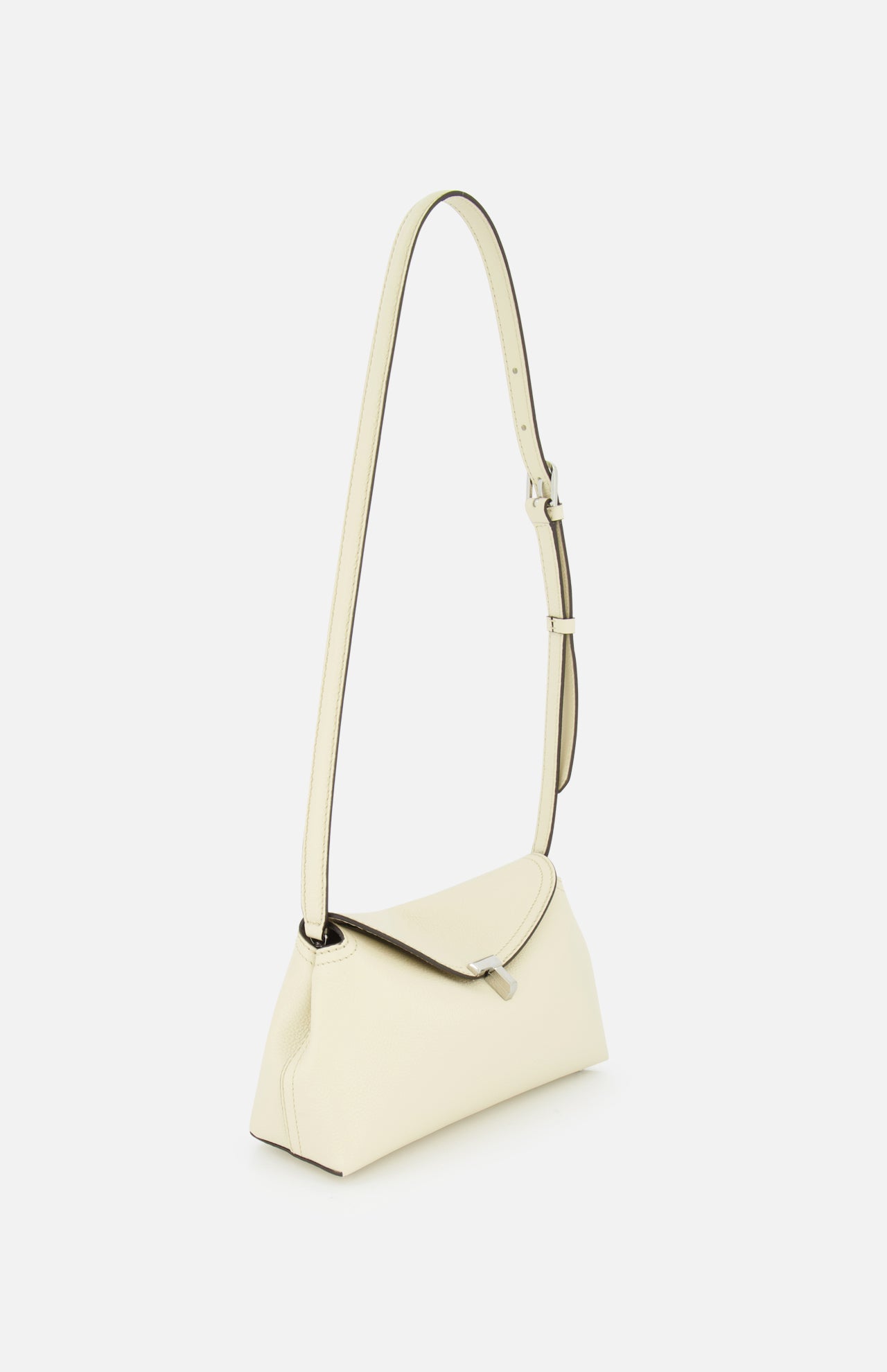 The TOTEME T-Lock Grained-Leather Clutch Bag is a minimalist cream accessory with a detachable strap, silver buckle, and structured rectangular shape, crafted from fine Italian leather and shown against a plain white background.