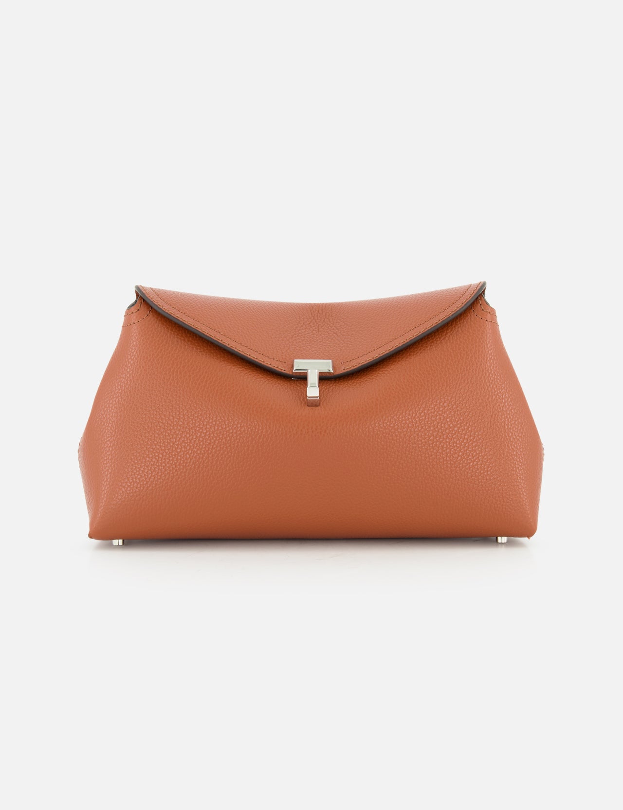The TOTEME T-Lock Grained-Leather Clutch Bag is a sculptural tan clutch with a textured finish, flap closure, and silver T-shaped clasp, displayed on a plain white background.