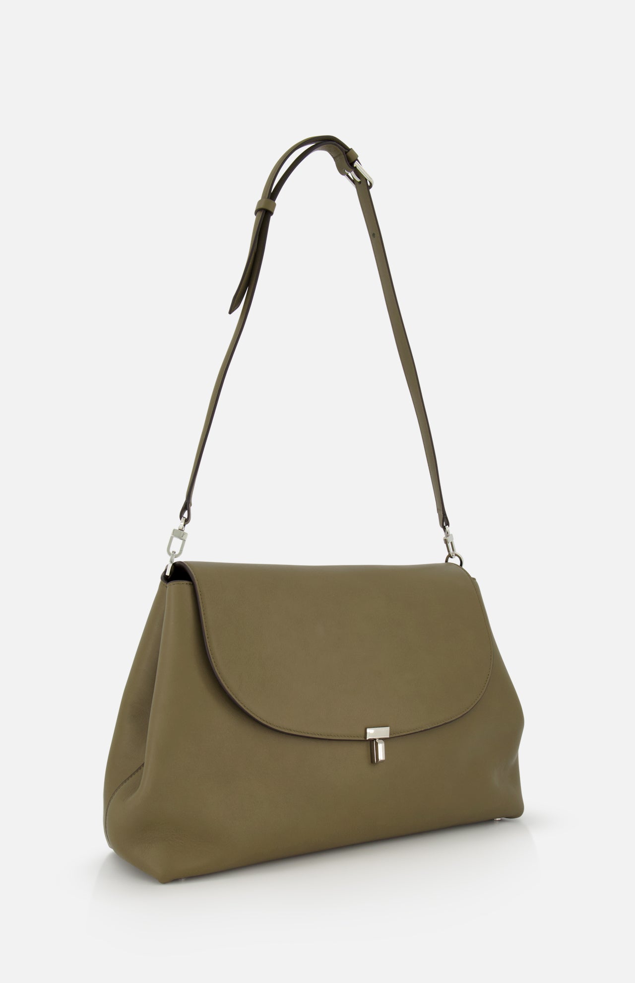 The TOTEME T-Lock Leather Satchel Bag, in medium size and olive green Italian leather, features a curved flap, silver clasp, and adjustable strap. It is displayed against a plain white background.