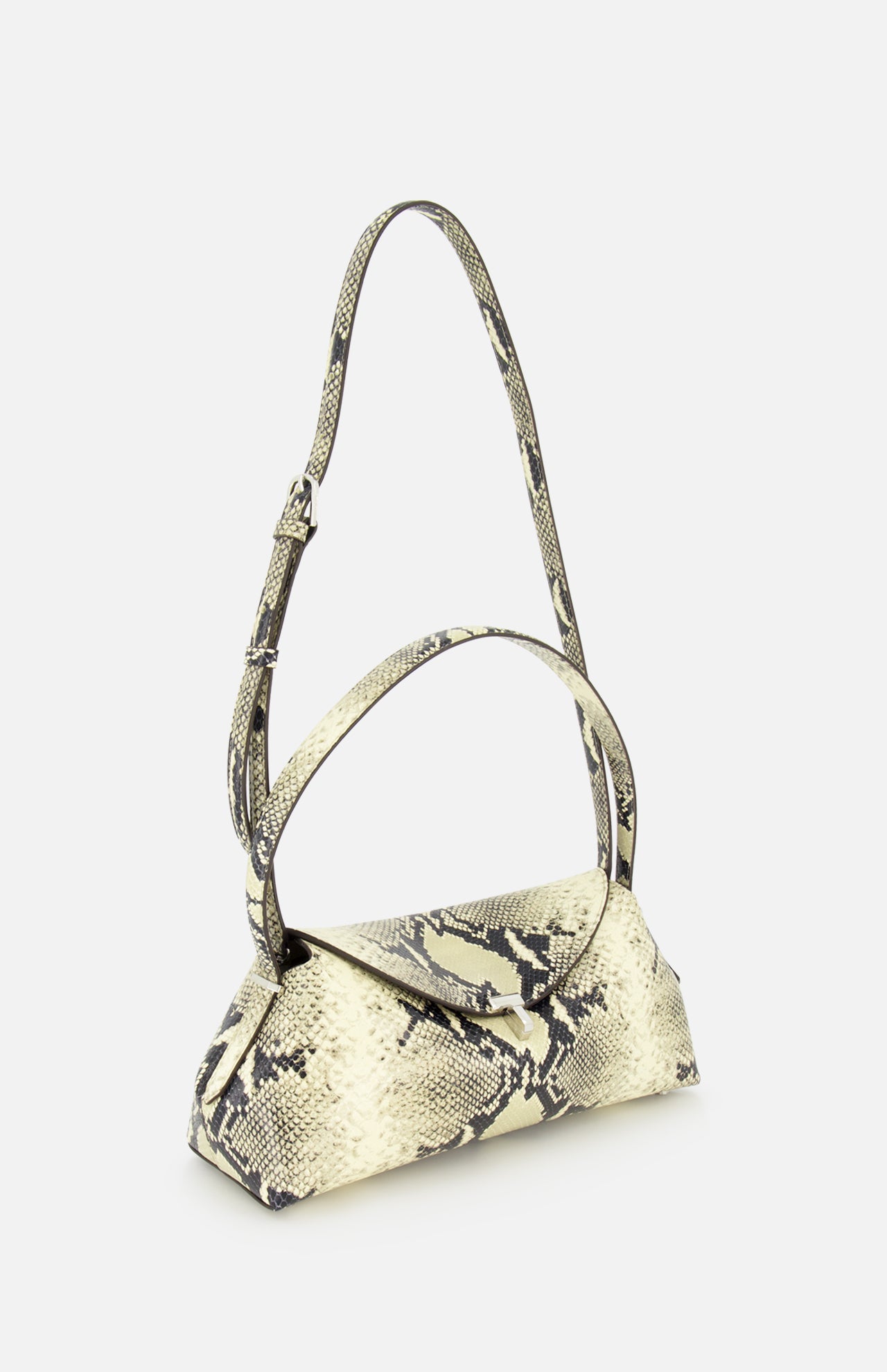 The TOTEME T-Lock Python Embossed Shoulder Bag is crafted from beige snake-effect leather with a bold black snakeskin pattern, featuring a top handle and an adjustable shoulder strap, and is displayed against a plain white background.