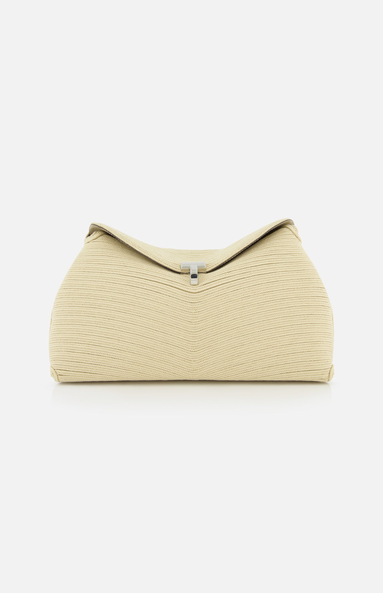 The TOTEME T-Lock Rope Clutch is a beige, sculptural bag with a textured finish and structured, rounded shape, accented by a small silver clasp on top. Photographed on a white background, it showcases timeless elegance.